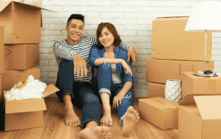young asian couple in new home happy with their mortgage